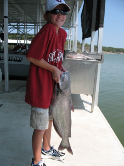 Caught this big blue cat on cut bait at Lake Tehoma. My dad and I caught about 30 stripers and about 15 catfish that morning.