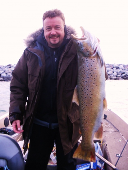 Giant Brown Trout around 20lbs, caught in WI in Late March. It was 33 inches long. When it swam by the boat and i saw how big it was my heart sank, i am just glad i got it in.