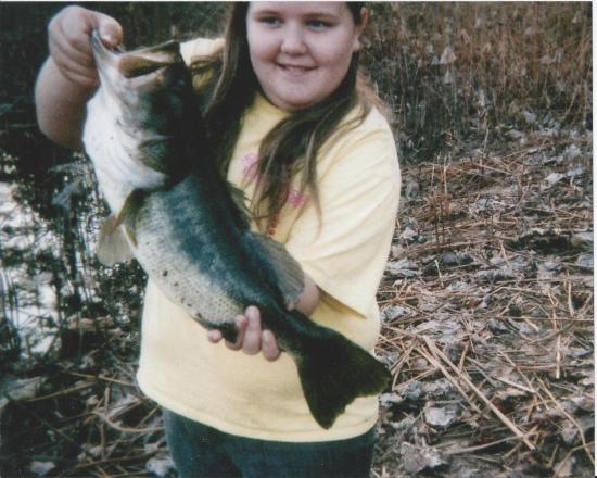 Hello this is the first big bass my little girl ever caught she was age ten at the time ,it was fall i had been trying to teach her texas rigging ,she learned good lol .She was fishing a junebug colored original culprit worm ,it was fall in a lotus infested pond my aunt owns ,thank you sincerely David Collins my daughters name is Shelby Grace Collins