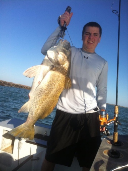 Trevor Dance - Bill's 4th cousin and Mike Dance's son - with a large black drum caught near Port O'Connor...