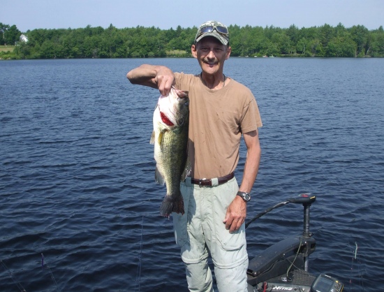 I caught this bass at 9:55 AM in Gardner Massachusetts in 4 feet of water.  she's an old girl weighing in at 14.2 pounds which may very well be a state record for this year here. I was using a 7' one piece graphite rod with matching reel on 12 pound P-Line copolymer line, with a Strike King Z-TOO swim bait with a 4.0 gamagatsu red hook.  This is a catch of a lifetime for me.  Please share this with the rest of your fans.