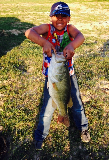 Great Grandson, John caught this 9lb 6 oz Largemouth Bass on the Grand Parents, TK Ranch in Forestburg, TX on May 3, 2015.