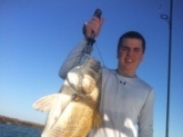 Trevor Dance - Bill's 4th cousin and Mike Dance's son - with a large black drum caught near Port O'Connor...