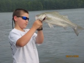 HI,THIS WAS MY FIRST STRIPED BASS.I CAUGHT IT ON A 3 IN. SHINER.