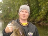 This Smallmouth was caught in the Shell Rock River in Northern Iowa late October 2008 on a Johnson Silver Minnow. The Length was 21 inches We did'nt want to stress the fish so we let it go. The scale was on the other side of the river. We estimate it was close to five pounds.