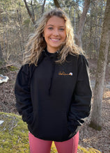 Load image into Gallery viewer, Lifestyle photo of woman wearing the Bill Dance logo hoodie